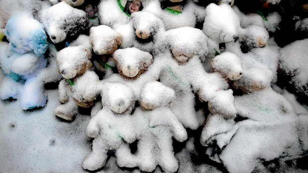 Snow-covered teddy bears at a memorial in Newtown, Connecticut.