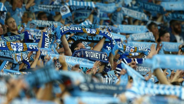 Fired up:  Sydney FC fans display their scarves during the match against Western Sydney.