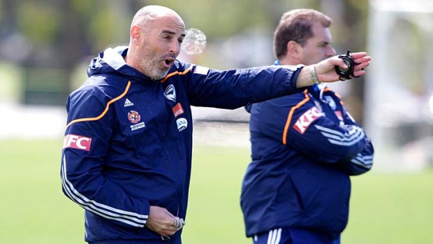 My way: Kevin Muscat calls the shots at Victory training as Ange Postecoglou looks on.