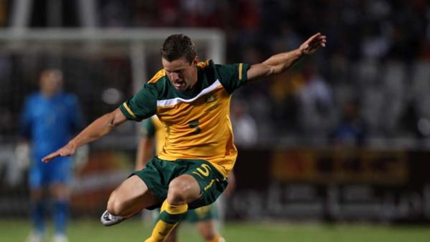 Curse of the Pharoahs ... Jason Culina is tackled in last week's friendly defeat to Egypt.