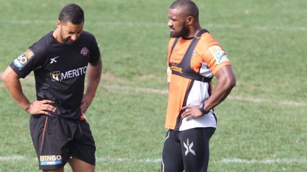 Great expectations: Benji Marshall chats with teammate Marika Koroibete at training this week. The Warriors are expecting Marshall, who has asked for a release from the Tigers and is considering a switch to rugby next year, to come out firing at Leichhardt Oval on Friday night.