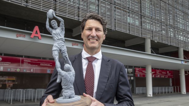 Former Queensland and Wallabies captain John Eales stands next to a model of a statue of himself at Suncorp Stadium, when the statue was conceived in May 2018.