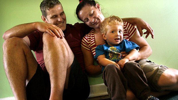 Erik Kelly, 2, with his mother, Maria Pekli, and father, Daniel Kelly.