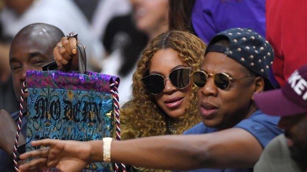 Big money: Beyonce with her husband Jay-Z, at an NBA playoff game between the Los Angeles Clippers and the Utah Jazz.