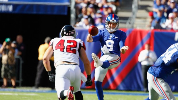 Kicking on: Brad Wing punts for the New York Giants.