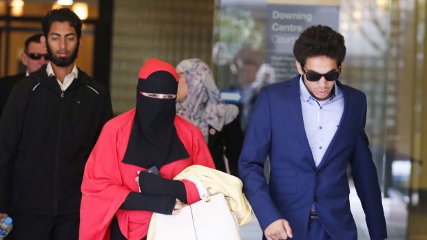 Mustafa Shiddiquzzaman, left, and Junaid Thorne, far right, leave the Downing Centre District Court during an appeal hearing on Wednesday. 