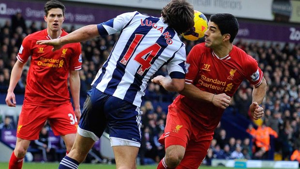 Liverpool's Uruguayan forward Luis Suarez (R) vies with West Bromwich Albion's Uruguayan defender Diego Lugano.