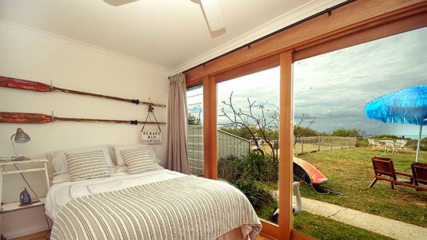 Chic shack ... the view from bed to lawn to dunes at On the Beach; dogs are welcome.