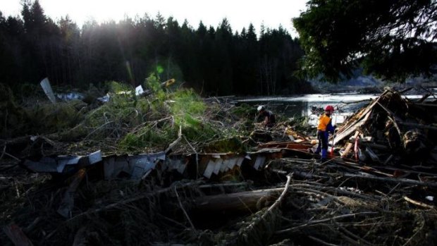 Search and rescue personnel continue working the area that was hit.