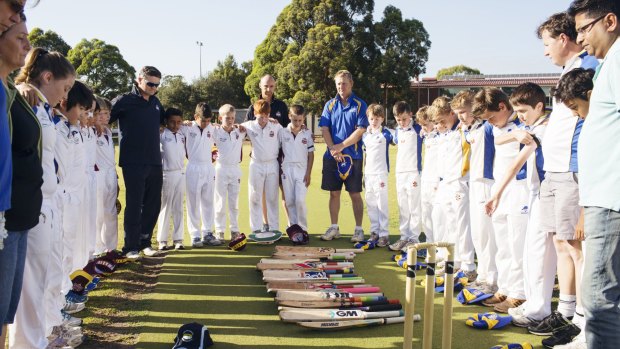 Tribute: Concord Briars Gold and Ryde Hunters Hill Swashbucklers players had a minute of silence for Phillip Hughes before the Under 11s match on Saturday.