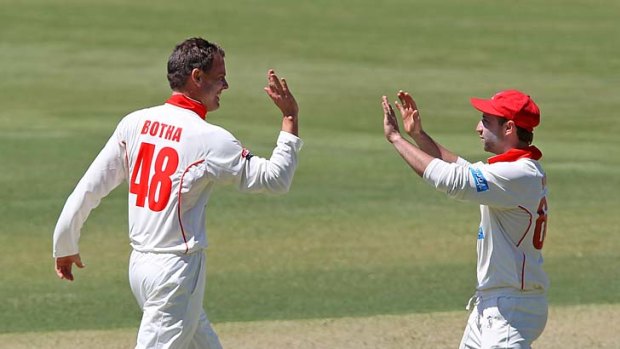 Phillip Hughes, seen here with Redbacks teammate Johan Botha, may be opening the batting for Australia this summer.