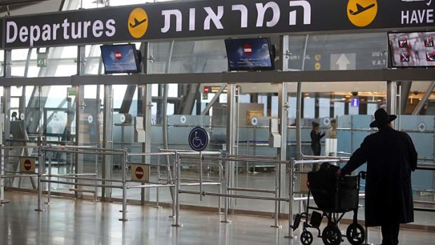 A passenger stands in the departure hall at Israel's Ben-Gurion International Airport near Tel Aviv. Security officials can demand access to tourists' emails before allowing them into the country, it has been revealed.