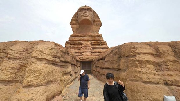 People visit the full-size replica of the Great Sphinx of Giza in a village near Shijiazhuang, in northern China's Hebei province.