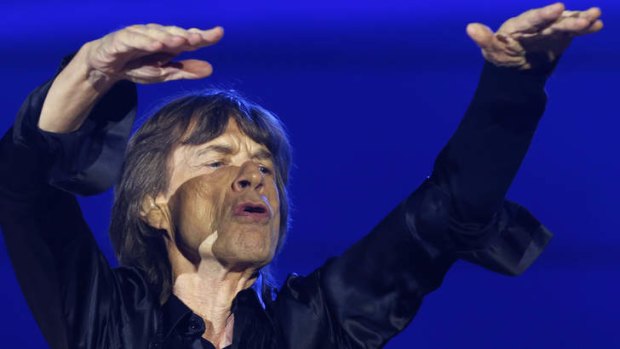 Mick Jagger plays up to the crowd during the Rolling Stones' performance  at Tokyo Domeion Wednesday.