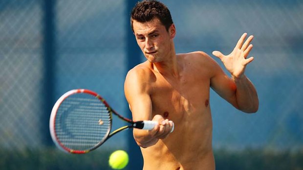 Bernard Tomic during a practice session at Sydney Olympic Park Tennis Centre on Sunday.
