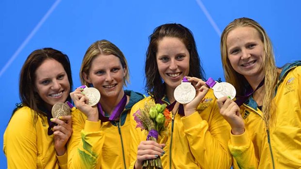 Leisel Jones (second from left) with Emily Seebohm, Alicia Coutts and Melanie Schlanger  after winning silver in the women's 4x100 medley relay final at the London 2012 Olympic Games on August 4, 2012 in London.