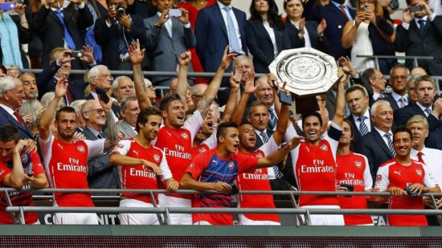 Welcome addition: Arsenal lift their second piece of silverware in three months.