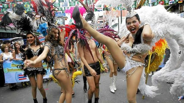 Dancers perform during a celebration to boost tourism in Bangkok.