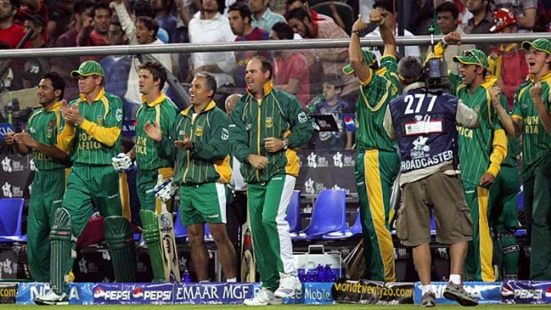 That winning feeling: Mickey Arthur (fifth from left) celebrates a South African Twenty20 victory.