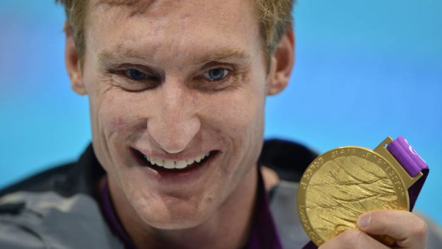"I'm still here" ... US swimmer Bradley Snyder poses with his gold medal.