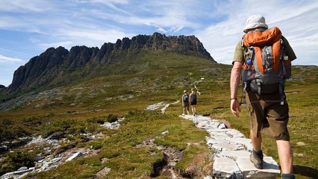 High road ... hikers climb Cradle Mountain.