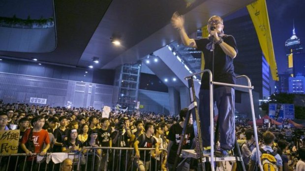 Keeping the pressure up ... Student leader Lester Shum speaks to thousands at a protest site on Wednesday in Hong Kong.