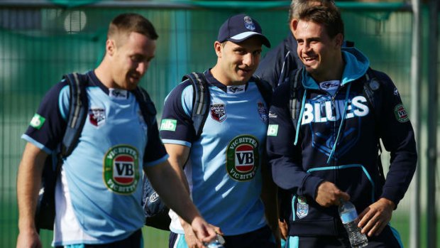 No Blues: Josh Reynolds, right, speaks with Robbie Farah, centre, and James Maloney after being named in the NSW side.
