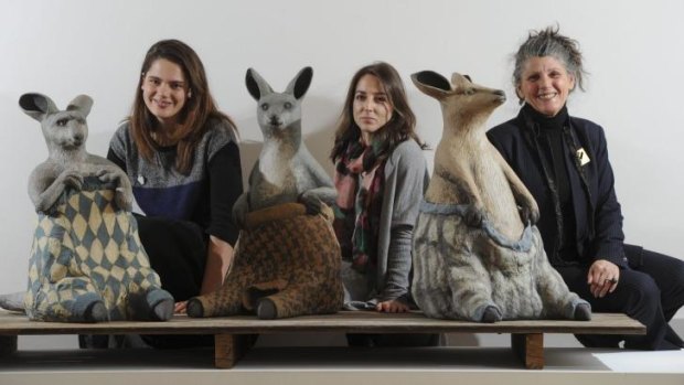 Australian Ceramics Triennale project managers Yasmin Masri (left) and Gwenyth Macnamara with chairwoman Avi Amesbury, pictured with Bev Hogg’s work <i>Wooly Jumpers 1, 2 and 3</i>, which feature in Craft ACT’s exhibition <i>Stomping Ground</i>, in the ACT Legislative Assembly gallery.