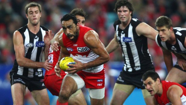 Sydney's Adam Goodes breaks clear of Collingwood opponents in last year's game at ANZ Stadium.