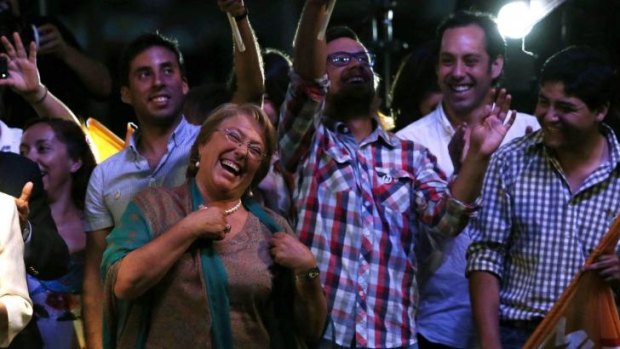 Happy day: Michelle Bachelet celebrates her victory in Chile's presidential election with supporters in Santiago.