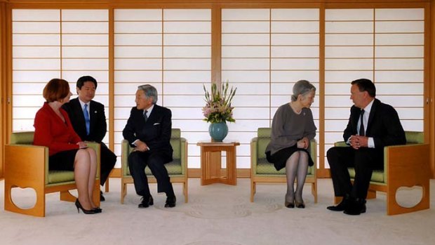 Diplomacy at work . . . Julia Gillard speaks with Emperor Akihito, third from left, while Tim Mathieson talks to Empress Michiko at the imperial couple's home.