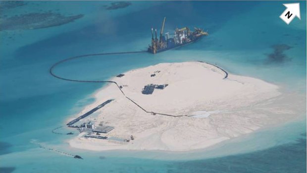 A Chinese vessel, top center, in the Spratly Islands at South China Sea, in this photo taken by a Philippines surveillance plane last year. 