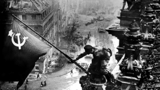 In the end, it fell mostly to the Soviets, pictured raising their flag over the Reichstag, Berlin, in 1945, to finish Hitler's dreams of empire.