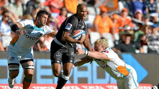 JP Pietersen of the Sharks takes on the Cheetahs defence.