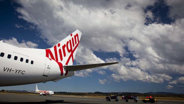 Tough times ... takeovers and trading conditions are hitting Virgin's bottom line.
