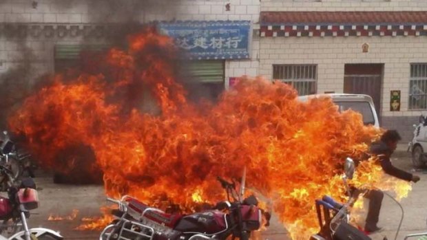 Self-immolation ... a Tibetan runs in flames in a protest against Chinese rule in Qinghai province.