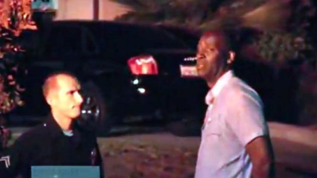 Michael Jace is detained by police outside his Los Angeles home on Monday night.