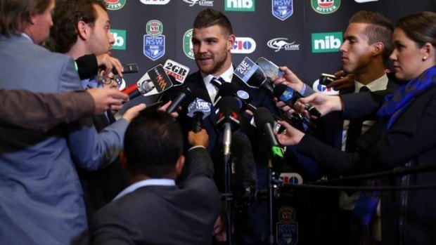 Main focus: Josh Dugan is surrounded by reporters at Tuesday's team announcement.