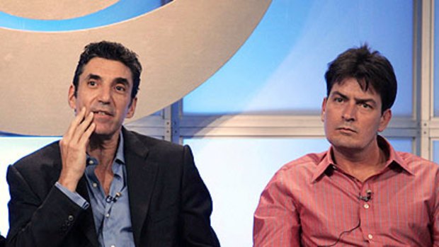 Charlie Sheen (right) and <I>Two and a Half Men</i> creator Chuck Lorre, who has become the focus of his rage over the show's axing.