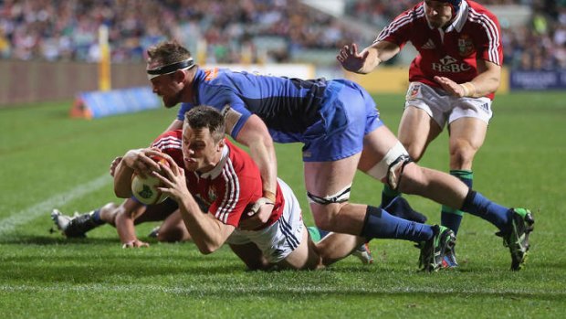 Western Farce: Tommy Bowe of the Lions dives over for a try.