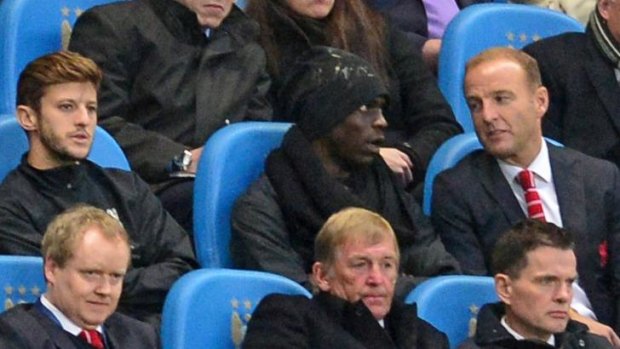 New challenge: Mario Balotelli in the stands at Liverpool's loss to Manchester City.