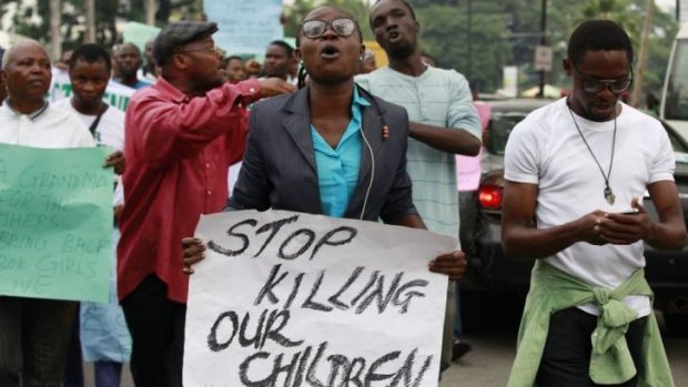 Protesters call on the Nigerian government to rescue kidnapped schoolgirls at a demonstration in Lagos.