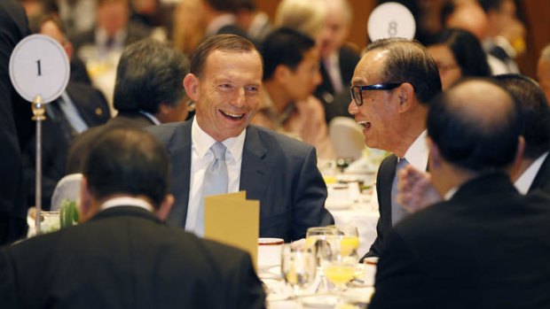 Confident: Prime Minister Tony Abbott talks with Suryo Bambang Sulisto.