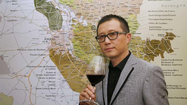 Dongjun Shen, director of Chinese jewellery group Tesiro,   toasts his company's  purchase of  Chateau Laulan Ducos.