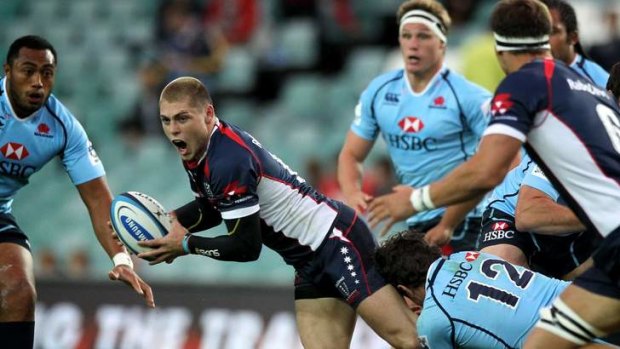On the burst: James O'Connor seeks a Melbourne Rebels teammate against the NSW Waratahs early this month.