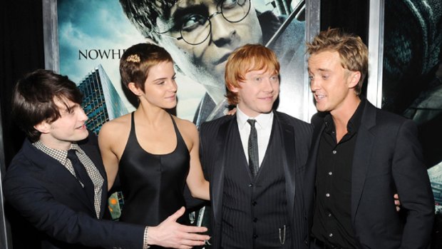 Dark horse ... Emma Watson tells how she fell for Harry Potter co-star Tom Felton, far right.