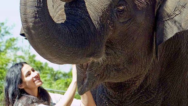 Zoo keeper Lucy Melo pictured alongside elephant Tang Mo in May.