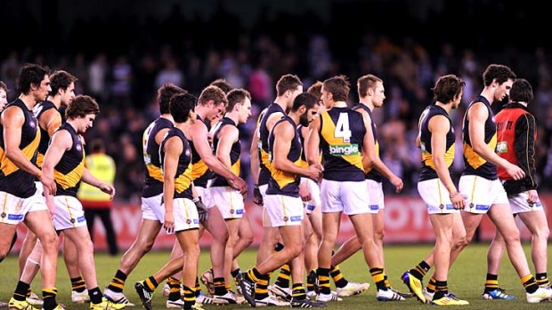 Richmond players after their loss to Geelong.