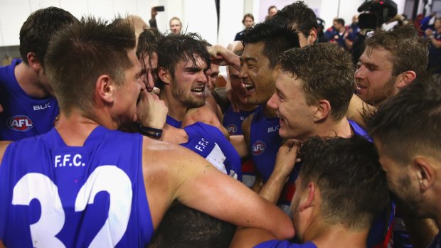 Up: The Western
Bulldogs celebrate after
their round 5 win over
Sydney.