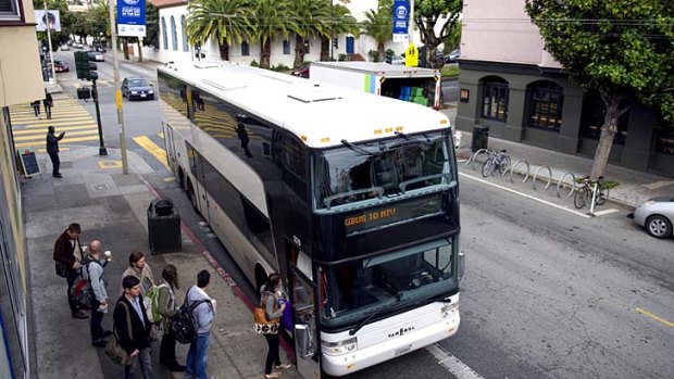 Google employees board a bus that will take them to the company's campus in Mountain View, Silicon Valley.